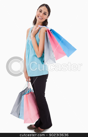 To use this stock image in your creative project, please select the size you need over to the right and click the "Add to Cart" button.
Your downloaded image will come with the Cutcaster watermark removed so don’t worry about the watermark you see on this page. Portrait of a woman posing with shopping bags stock photo, Portrait of a woman posing with shopping bags against a white background by Wavebreak Media