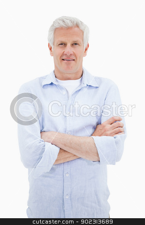 To use this stock image in your creative project, please select the size you need over to the right and click the "Add to Cart" button.
Your downloaded image will come with the Cutcaster watermark removed so don’t worry about the watermark you see on this page. Portrait of a smiling mature man with the arms crossed stock photo, Portrait of a smiling mature man with the arms crossed against a white background by Wavebreak Media