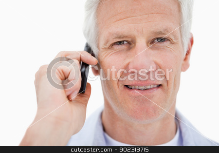 To use this stock image in your creative project, please select the size you need over to the right and click the "Add to Cart" button.
Your downloaded image will come with the Cutcaster watermark removed so don’t worry about the watermark you see on this page. Smiling mature man making a phone call stock photo, Smiling mature man making a phone call against a white background by Wavebreak Media