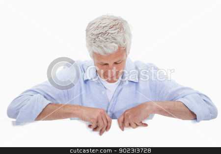 To use this stock image in your creative project, please select the size you need over to the right and click the "Add to Cart" button.
Your downloaded image will come with the Cutcaster watermark removed so don’t worry about the watermark you see on this page. Portrait of a man standing behind blank panel stock photo, Portrait of a man standing behind blank panel against a white background by Wavebreak Media
