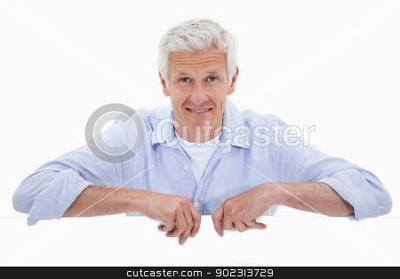 To use this stock image in your creative project, please select the size you need over to the right and click the "Add to Cart" button.
Your downloaded image will come with the Cutcaster watermark removed so don’t worry about the watermark you see on this page. Portrait of a smiling mature man standing behind blank panel stock photo, Portrait of a smiling mature man standing behind blank panel against a white background by Wavebreak Media