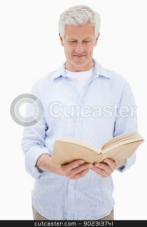 To use this stock image in your creative project, please select the size you need over to the right and click the "Add to Cart" button.
Your downloaded image will come with the Cutcaster watermark removed so don’t worry about the watermark you see on this page. Portrait of a man reading a book stock photo, Portrait of a man reading a book against a white background by Wavebreak Media