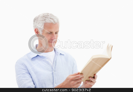 To use this stock image in your creative project, please select the size you need over to the right and click the "Add to Cart" button.
Your downloaded image will come with the Cutcaster watermark removed so don’t worry about the watermark you see on this page. Man reading a book stock photo, Man reading a book against a white background by Wavebreak Media