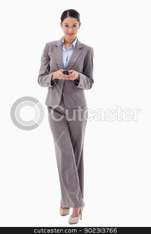 To use this stock image in your creative project, please select the size you need over to the right and click the "Add to Cart" button.
Your downloaded image will come with the Cutcaster watermark removed so don’t worry about the watermark you see on this page. Portrait of a smiling brunette businesswoman sending a text mess stock photo, Portrait of a smiling brunette businesswoman sending a text message against a white background by Wavebreak Media