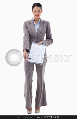 To use this stock image in your creative project, please select the size you need over to the right and click the "Add to Cart" button.
Your downloaded image will come with the Cutcaster watermark removed so don’t worry about the watermark you see on this page. Portrait of a smiling businesswoman showing a contract stock photo, Portrait of a smiling businesswoman showing a contract against a white background by Wavebreak Media