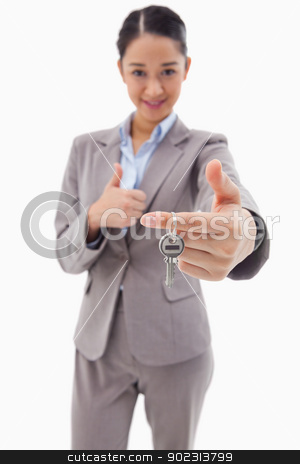 To use this stock image in your creative project, please select the size you need over to the right and click the "Add to Cart" button.
Your downloaded image will come with the Cutcaster watermark removed so don’t worry about the watermark you see on this page. Portrait of a businesswoman holding a key with the thumb up stock photo, Portrait of a businesswoman holding a key with the thumb up against a white background by Wavebreak Media