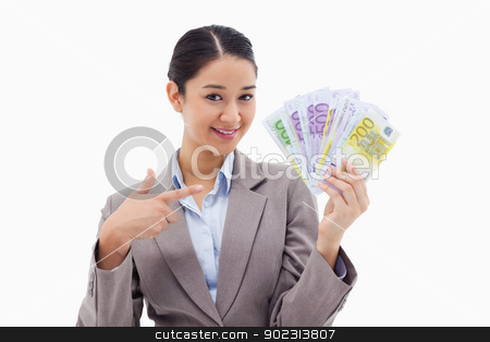 To use this stock image in your creative project, please select the size you need over to the right and click the "Add to Cart" button.
Your downloaded image will come with the Cutcaster watermark removed so don’t worry about the watermark you see on this page. Smiling businesswoman holding bank notes stock photo, Smiling businesswoman holding bank notes against a white background by Wavebreak Media