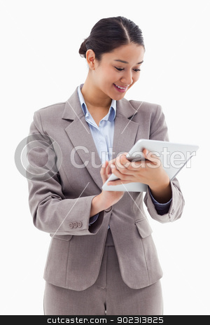 To use this stock image in your creative project, please select the size you need over to the right and click the "Add to Cart" button.
Your downloaded image will come with the Cutcaster watermark removed so don’t worry about the watermark you see on this page. Portrait of a businesswoman using a tablet computer stock photo, Portrait of a businesswoman using a tablet computer against a white background by Wavebreak Media