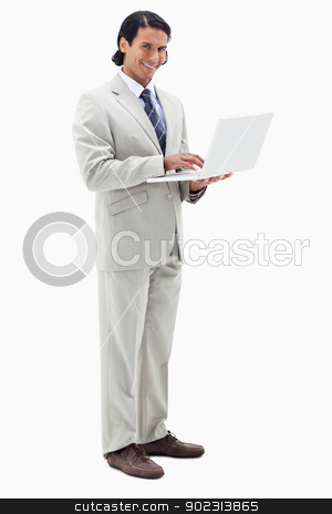 To use this stock image in your creative project, please select the size you need over to the right and click the "Add to Cart" button.
Your downloaded image will come with the Cutcaster watermark removed so don’t worry about the watermark you see on this page. Portrait of a smiling businessman using a notebook stock photo, Portrait of a smiling businessman using a notebook against a white background by Wavebreak Media