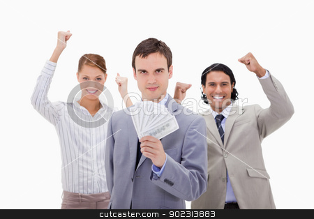 To use this stock image in your creative project, please select the size you need over to the right and click the "Add to Cart" button.
Your downloaded image will come with the Cutcaster watermark removed so don’t worry about the watermark you see on this page. Businessman with cheering colleagues and money stock photo, Businessman with cheering colleagues and money against a white background by Wavebreak Media