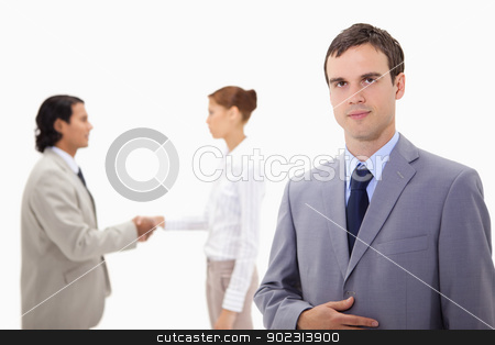 To use this stock image in your creative project, please select the size you need over to the right and click the "Add to Cart" button.
Your downloaded image will come with the Cutcaster watermark removed so don’t worry about the watermark you see on this page. Businessman with hand shaking colleagues behind him stock photo, Businessman with hand shaking colleagues behind him against a white background by Wavebreak Media