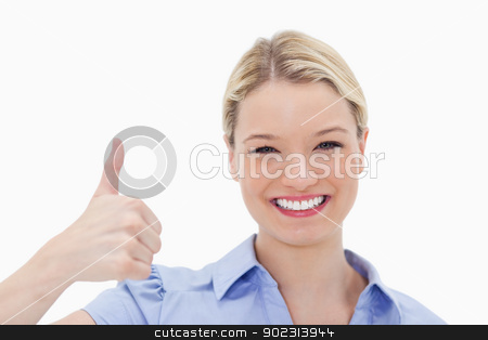 To use this stock image in your creative project, please select the size you need over to the right and click the "Add to Cart" button.
Your downloaded image will come with the Cutcaster watermark removed so don’t worry about the watermark you see on this page. Smiling woman giving thumb up stock photo, Smiling woman giving thumb up against a white background by Wavebreak Media