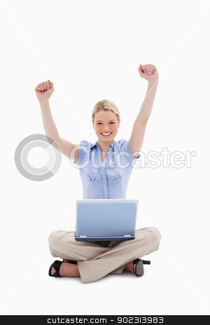 To use this stock image in your creative project, please select the size you need over to the right and click the "Add to Cart" button.
Your downloaded image will come with the Cutcaster watermark removed so don’t worry about the watermark you see on this page. Woman with laptop raising her hands stock photo, Woman with laptop raising her hands against a white background by Wavebreak Media