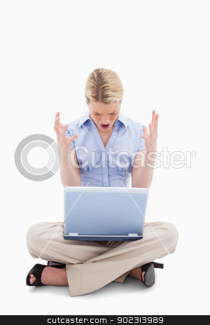 To use this stock image in your creative project, please select the size you need over to the right and click the "Add to Cart" button.
Your downloaded image will come with the Cutcaster watermark removed so don’t worry about the watermark you see on this page. Sitting woman yelling at her laptop stock photo, Sitting woman yelling at her laptop against a white background by Wavebreak Media