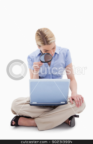 To use this stock image in your creative project, please select the size you need over to the right and click the "Add to Cart" button.
Your downloaded image will come with the Cutcaster watermark removed so don’t worry about the watermark you see on this page. Woman using magnifier to look at her laptop stock photo, Woman using magnifier to look at her laptop against a white background by Wavebreak Media