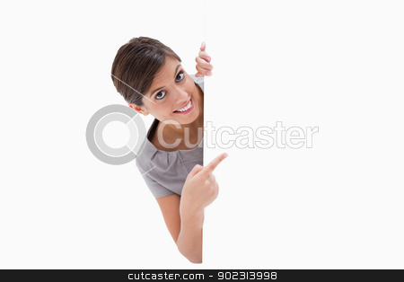 To use this stock image in your creative project, please select the size you need over to the right and click the "Add to Cart" button.
Your downloaded image will come with the Cutcaster watermark removed so don’t worry about the watermark you see on this page. Smiling woman pointing around the corner stock photo, Smiling woman pointing around the corner against a white background by Wavebreak Media