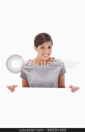 To use this stock image in your creative project, please select the size you need over to the right and click the "Add to Cart" button.
Your downloaded image will come with the Cutcaster watermark removed so don’t worry about the watermark you see on this page. Smiling woman looking over blank wall stock photo, Smiling woman looking over blank wall against a white background by Wavebreak Media