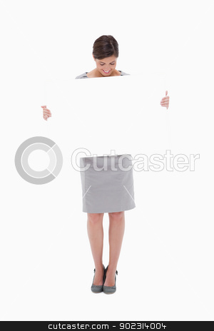 To use this stock image in your creative project, please select the size you need over to the right and click the "Add to Cart" button.
Your downloaded image will come with the Cutcaster watermark removed so don’t worry about the watermark you see on this page. Woman looking down at blank sign in her hands stock photo, Woman looking down at blank sign in her hands against a white background by Wavebreak Media