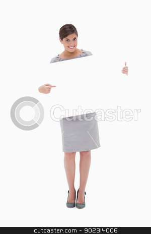 To use this stock image in your creative project, please select the size you need over to the right and click the "Add to Cart" button.
Your downloaded image will come with the Cutcaster watermark removed so don’t worry about the watermark you see on this page. Smiling woman pointing at blank sign in her hands stock photo, Smiling woman pointing at blank sign in her hands against a white background by Wavebreak Media