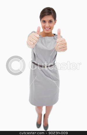 To use this stock image in your creative project, please select the size you need over to the right and click the "Add to Cart" button.
Your downloaded image will come with the Cutcaster watermark removed so don’t worry about the watermark you see on this page. Smiling woman giving thumbs up stock photo, Smiling woman giving thumbs up against a white background by Wavebreak Media