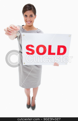 To use this stock image in your creative project, please select the size you need over to the right and click the "Add to Cart" button.
Your downloaded image will come with the Cutcaster watermark removed so don’t worry about the watermark you see on this page. Real estate agent with sold sign handing over key stock photo, Real estate agent with sold sign handing over key against a white background by Wavebreak Media
