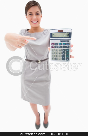 To use this stock image in your creative project, please select the size you need over to the right and click the "Add to Cart" button.
Your downloaded image will come with the Cutcaster watermark removed so don’t worry about the watermark you see on this page. Woman pointing at hand calculator stock photo, Woman pointing at hand calculator against a white background by Wavebreak Media