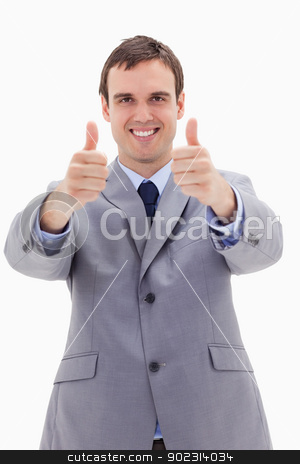 To use this stock image in your creative project, please select the size you need over to the right and click the "Add to Cart" button.
Your downloaded image will come with the Cutcaster watermark removed so don’t worry about the watermark you see on this page. Smiling businessman giving thumbs up stock photo, Smiling businessman giving thumbs up against a white background by Wavebreak Media