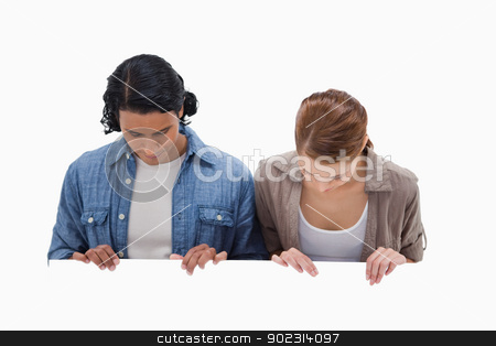 To use this stock image in your creative project, please select the size you need over to the right and click the "Add to Cart" button.
Your downloaded image will come with the Cutcaster watermark removed so don’t worry about the watermark you see on this page. Couple looking down on blank wall stock photo, Couple looking down on blank wall against a white background by Wavebreak Media