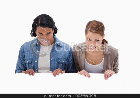 To use this stock image in your creative project, please select the size you need over to the right and click the "Add to Cart" button.
Your downloaded image will come with the Cutcaster watermark removed so don’t worry about the watermark you see on this page. Smiling couple looking over blank wall stock photo, Smiling couple looking over blank wall against a white background by Wavebreak Media