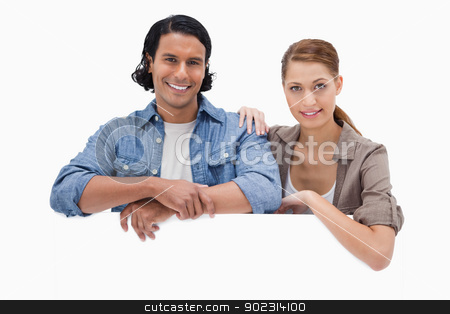 To use this stock image in your creative project, please select the size you need over to the right and click the "Add to Cart" button.
Your downloaded image will come with the Cutcaster watermark removed so don’t worry about the watermark you see on this page. Couple leaning on blank wall stock photo, Couple leaning on blank wall against a white background by Wavebreak Media