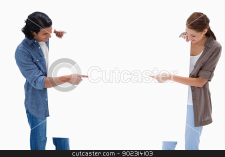 To use this stock image in your creative project, please select the size you need over to the right and click the "Add to Cart" button.
Your downloaded image will come with the Cutcaster watermark removed so don’t worry about the watermark you see on this page. Couple looking and pointing at blank sign in their hands stock photo, Couple looking and pointing at blank sign in their hands against a white background by Wavebreak Media