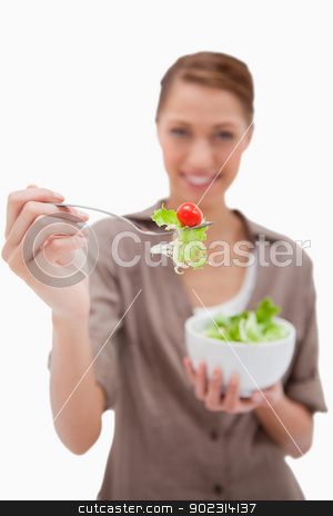 To use this stock image in your creative project, please select the size you need over to the right and click the "Add to Cart" button.
Your downloaded image will come with the Cutcaster watermark removed so don’t worry about the watermark you see on this page. Woman offering salad on a fork stock photo, Woman offering salad on a fork against a white background by Wavebreak Media