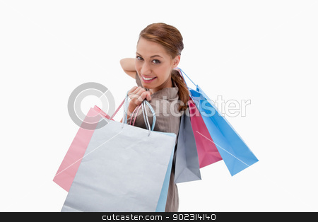 To use this stock image in your creative project, please select the size you need over to the right and click the "Add to Cart" button.
Your downloaded image will come with the Cutcaster watermark removed so don’t worry about the watermark you see on this page. Side view of smiling woman with shopping bags stock photo, Side view of smiling woman with shopping bags against a white background by Wavebreak Media
