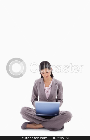 To use this stock image in your creative project, please select the size you need over to the right and click the "Add to Cart" button.
Your downloaded image will come with the Cutcaster watermark removed so don’t worry about the watermark you see on this page. Sitting woman working with laptop stock photo, Sitting woman working with laptop against a white background by Wavebreak Media