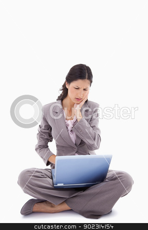 To use this stock image in your creative project, please select the size you need over to the right and click the "Add to Cart" button.
Your downloaded image will come with the Cutcaster watermark removed so don’t worry about the watermark you see on this page. Sitting woman having trouble with laptop stock photo, Sitting woman having trouble with laptop against a white background by Wavebreak Media