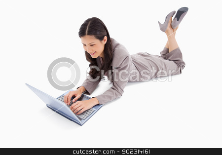 To use this stock image in your creative project, please select the size you need over to the right and click the "Add to Cart" button.
Your downloaded image will come with the Cutcaster watermark removed so don’t worry about the watermark you see on this page. Lying woman working on her notebook stock photo, Lying woman working on her notebook against a white background by Wavebreak Media
