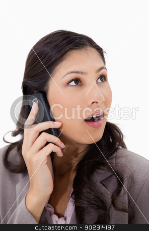 To use this stock image in your creative project, please select the size you need over to the right and click the "Add to Cart" button.
Your downloaded image will come with the Cutcaster watermark removed so don’t worry about the watermark you see on this page. Surprised woman on the phone stock photo, Surprised woman on the phone against a white background by Wavebreak Media