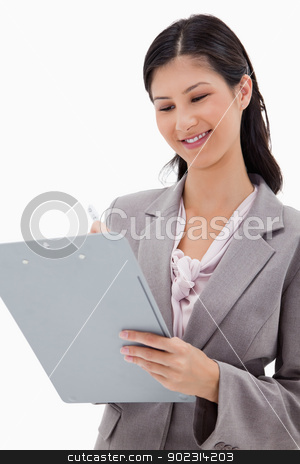 To use this stock image in your creative project, please select the size you need over to the right and click the "Add to Cart" button.
Your downloaded image will come with the Cutcaster watermark removed so don’t worry about the watermark you see on this page. Smiling businesswoman with clipboard stock photo, Smiling businesswoman with clipboard against a white background by Wavebreak Media