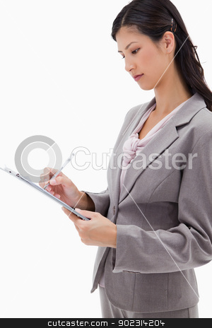 To use this stock image in your creative project, please select the size you need over to the right and click the "Add to Cart" button.
Your downloaded image will come with the Cutcaster watermark removed so don’t worry about the watermark you see on this page. Side view of businesswoman with clipboard stock photo, Side view of businesswoman with clipboard against a white background by Wavebreak Media