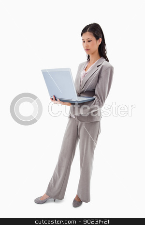 To use this stock image in your creative project, please select the size you need over to the right and click the "Add to Cart" button.
Your downloaded image will come with the Cutcaster watermark removed so don’t worry about the watermark you see on this page. Side view of businesswoman standing with notebook stock photo, Side view of businesswoman standing with notebook against a white background by Wavebreak Media