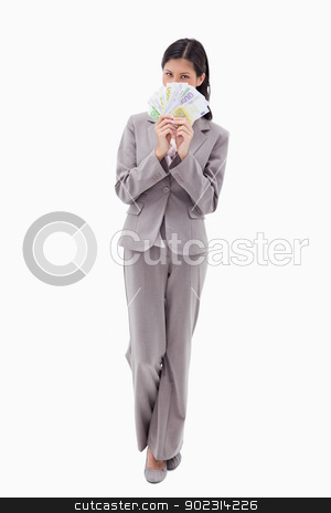 To use this stock image in your creative project, please select the size you need over to the right and click the "Add to Cart" button.
Your downloaded image will come with the Cutcaster watermark removed so don’t worry about the watermark you see on this page. Businesswoman hiding face behind bank notes stock photo, Businesswoman hiding face behind bank notes against a white background by Wavebreak Media