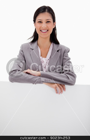 To use this stock image in your creative project, please select the size you need over to the right and click the "Add to Cart" button.
Your downloaded image will come with the Cutcaster watermark removed so don’t worry about the watermark you see on this page. Smiling businesswoman leaning on blank wall stock photo, Smiling businesswoman leaning on blank wall against a white background by Wavebreak Media