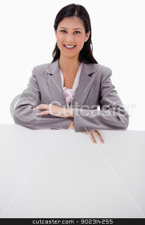 To use this stock image in your creative project, please select the size you need over to the right and click the "Add to Cart" button.
Your downloaded image will come with the Cutcaster watermark removed so don’t worry about the watermark you see on this page. Smiling young businesswoman leaning on blank wall stock photo, Smiling young businesswoman leaning on blank wall against a white background by Wavebreak Media
