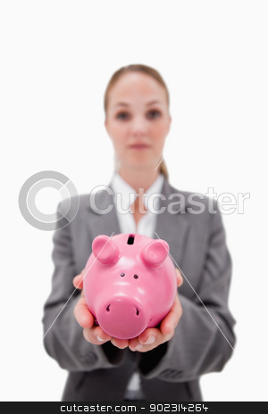 To use this stock image in your creative project, please select the size you need over to the right and click the "Add to Cart" button.
Your downloaded image will come with the Cutcaster watermark removed so don’t worry about the watermark you see on this page. Piggy bank being held by bank employee stock photo, Piggy bank being held by bank employee against a white background by Wavebreak Media