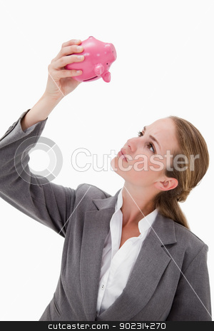 To use this stock image in your creative project, please select the size you need over to the right and click the "Add to Cart" button.
Your downloaded image will come with the Cutcaster watermark removed so don’t worry about the watermark you see on this page. Bank employee looking at piggy bank stock photo, Bank employee looking at piggy bank against a white background by Wavebreak Media
