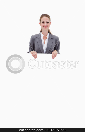 To use this stock image in your creative project, please select the size you need over to the right and click the "Add to Cart" button.
Your downloaded image will come with the Cutcaster watermark removed so don’t worry about the watermark you see on this page. Bank employee holding blank sign in her hands stock photo, Bank employee holding blank sign in her hands against a white background by Wavebreak Media