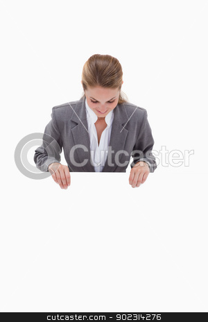 To use this stock image in your creative project, please select the size you need over to the right and click the "Add to Cart" button.
Your downloaded image will come with the Cutcaster watermark removed so don’t worry about the watermark you see on this page. Bank employee looking down at blank sign in her hands stock photo, Bank employee looking down at blank sign in her hands against a white background by Wavebreak Media