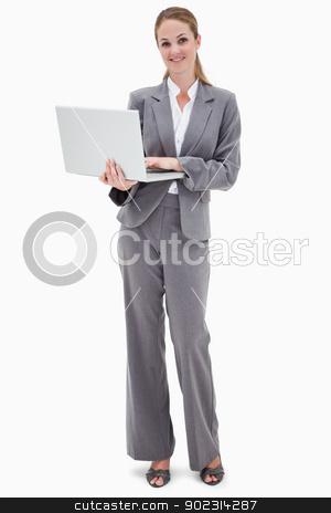To use this stock image in your creative project, please select the size you need over to the right and click the "Add to Cart" button.
Your downloaded image will come with the Cutcaster watermark removed so don’t worry about the watermark you see on this page. Smiling bank employee with laptop stock photo, Smiling bank employee with laptop against a white background by Wavebreak Media