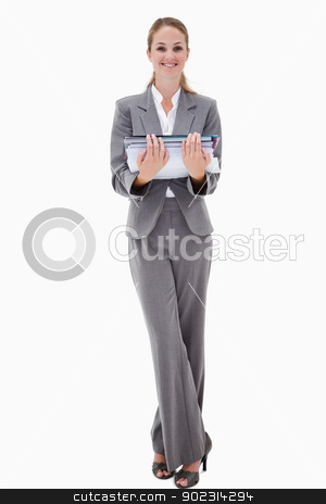 To use this stock image in your creative project, please select the size you need over to the right and click the "Add to Cart" button.
Your downloaded image will come with the Cutcaster watermark removed so don’t worry about the watermark you see on this page. Smiling office employee holding pile of paperwork stock photo, Smiling office employee holding pile of paperwork against a white background by Wavebreak Media