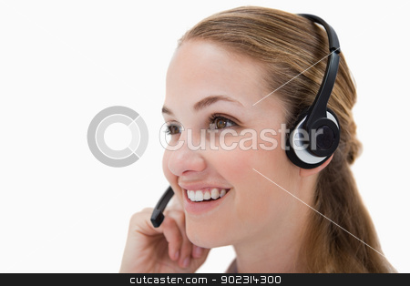 To use this stock image in your creative project, please select the size you need over to the right and click the "Add to Cart" button.
Your downloaded image will come with the Cutcaster watermark removed so don’t worry about the watermark you see on this page. Side view of smiling call center agent stock photo, Side view of smiling call center agent against a white background by Wavebreak Media